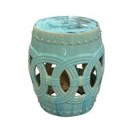The Mint Circle Garden Stool features circular cutout patterns, a glossy mint ceramic finish, and an antique look inspired by traditional dragon kiln craftsmanship.