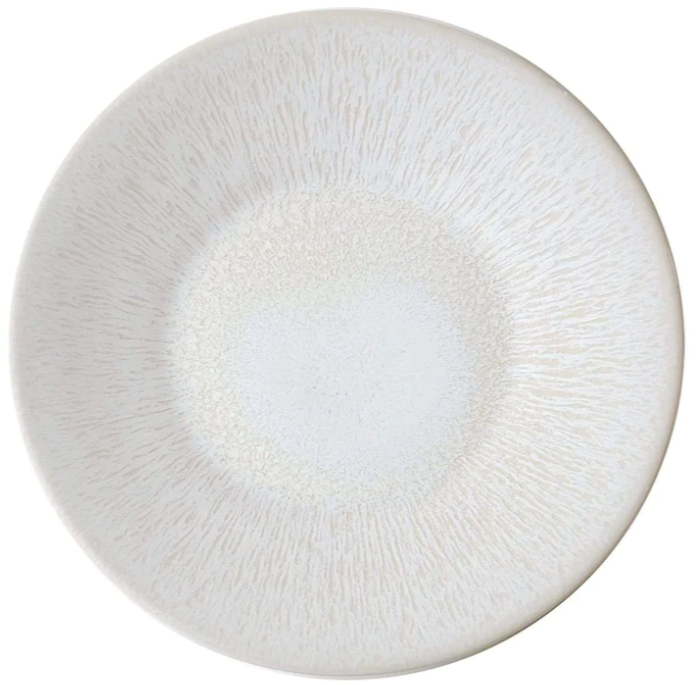 A round, white ceramic plate with a subtle textured pattern radiating from the center, embodying classic and refined timeless elegance from the Jars Vuelta White Pearl Collection.