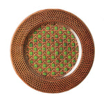 A round wicker plate with a geometric pattern, part of the Mario Luca Giusti Patagonia Green Collection, and reflecting Mario Luca Giusti's dedication to modern shapes and colors.