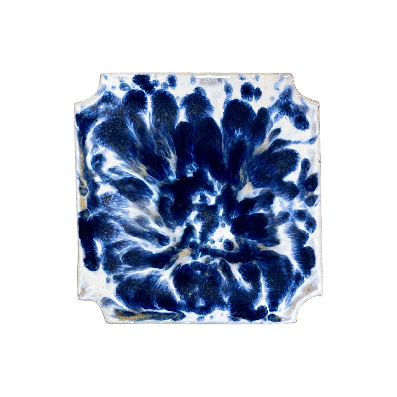 The White and Blue Square Garden Stool features a square ceramic design with raised edges, showcasing a blue and white abstract marbled pattern inspired by traditional dragon kiln firing for an antique finish.