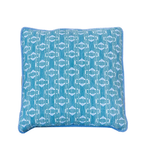 Sicily Outdoor Pillow in square blue features a striking white geometric fish pattern and blue piping along the edges. Expertly crafted from the finest materials, this 22x22 pillow is showcased against a crisp white background.