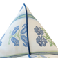 Close-up of the Folk Floral Pillow, a pointed fabric design with blue piping, featuring blue and green floral and striped patterns on a white background—expertly crafted for custom pillows with a hidden zipper closure.
