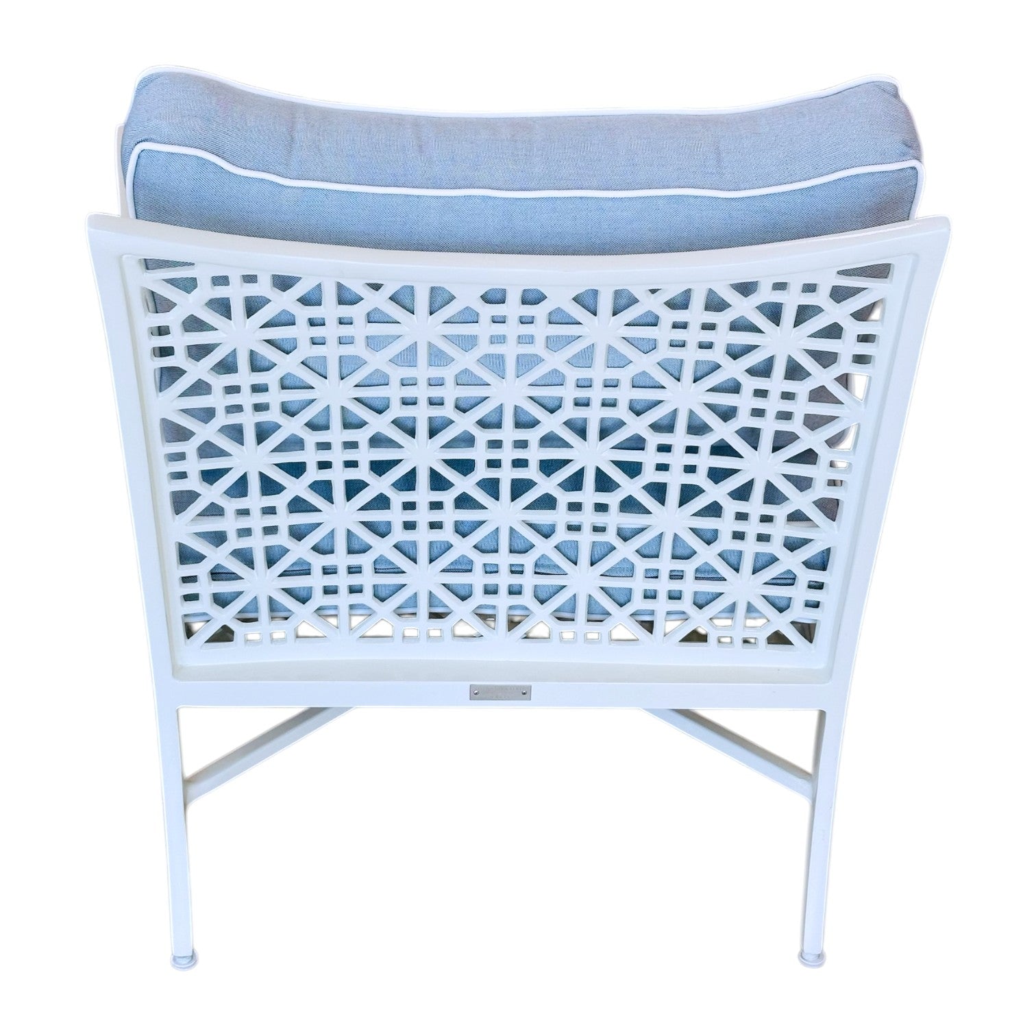 The Haret Outdoor Lounge Chair is a white metal chair with signature fretwork on the backrest and a plush light blue cushion, offering both style and comfort for your outdoor space.
