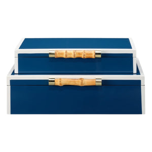 The Kalena Box in Navy, Large features two stacked blue rectangular boxes with white trim and light brown bamboo handles, adding an organic touch to any space.