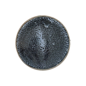 A round ceramic piece with a speckled black and gray glaze, reminiscent of fine porcelain, similar to the Feathered Grey Barrel Stool, viewed from above against a white background.