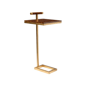 The Edgar Laptop Table features a gold texturized steel frame, a rectangular base, and a high-gloss faux tortoise square tabletop with a matching handle for modern style and functionality.