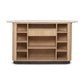The Anton Bar features open wooden shelves, a central drawer, and a rounded marble top—all in a stylish front-facing design that blends chic looks with practical storage.