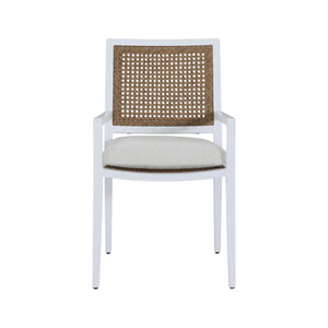 The Bermuda Arm Chair features a white frame, cane backrest, beige cushioned seat, and straight armrests, shown from the front against a plain background—ideal for outdoor dining.