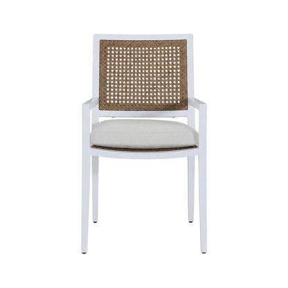 The Bermuda Arm Chair features a white frame, cane backrest, beige cushioned seat, and straight armrests, shown from the front against a plain background—ideal for outdoor dining.