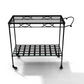 The Amalfi Bar Cart is crafted from powder-coated steel with two glass shelves, a decorative handle, and four wheels. Shown on a white background.