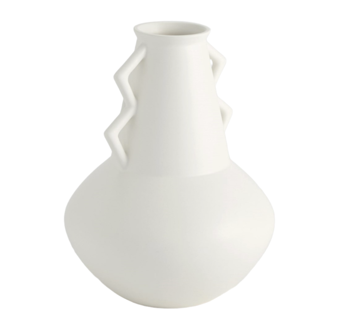 Handmade in Portugal, the Crete Fat Bottom Vase features a bulbous base, a narrow neck, and zigzag handle designs on both sides, all finished with a matte white glaze.