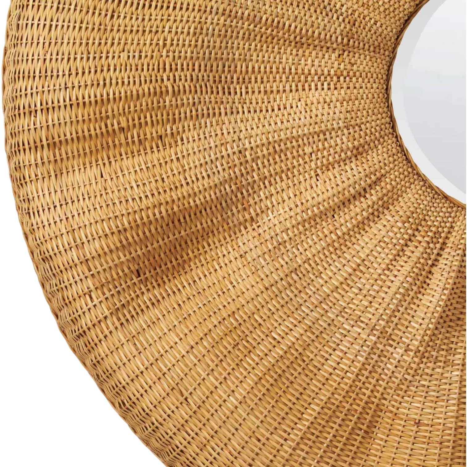 Close-up of the Larkin Rattan Mirror, featuring a wide, textured round frame and reflecting light—an ideal statement wall mirror for bohemian decor.