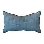 The Flatland Bluestone Lumbar Pillow features a subtle grid pattern and dark piping on the edges, shown against a white background—a stylish accent for any room.