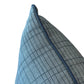 Close-up of the Flatland Bluestone Lumbar Pillow, showcasing its blue grid pattern and dark blue piping along the edge, set against a white background.