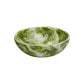 The Nashi Home Serveware Collection, Forest, features a round bowl with a green and white marbled pattern—crafted from resinware for a striking serving piece or unique home decor accent. Shown on a white background.