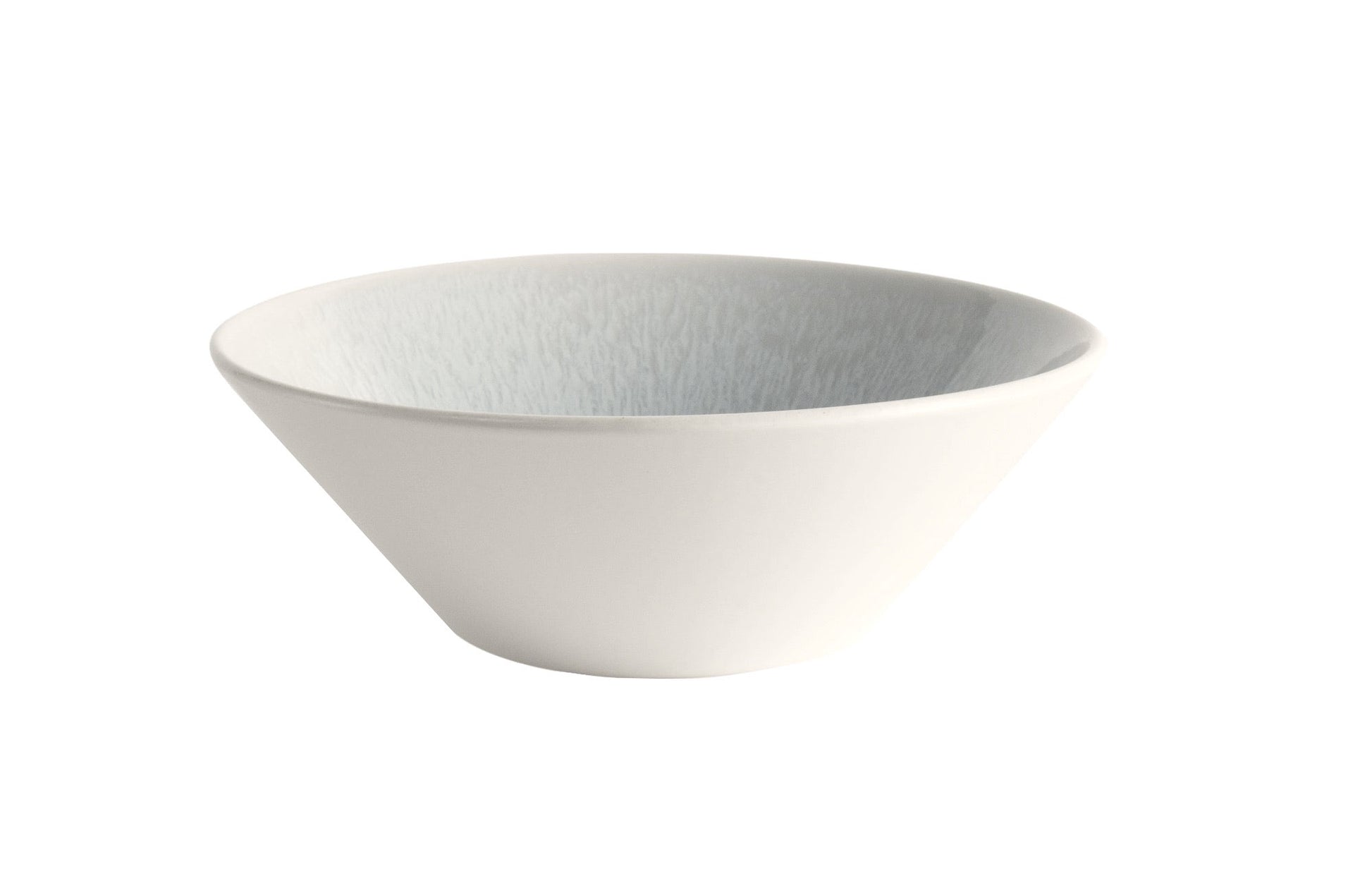 The Jars Vuelta White Pearl Collection bowl, featuring a plain white ceramic design with a slightly textured interior, exudes classic elegance and showcases its timeless appeal.