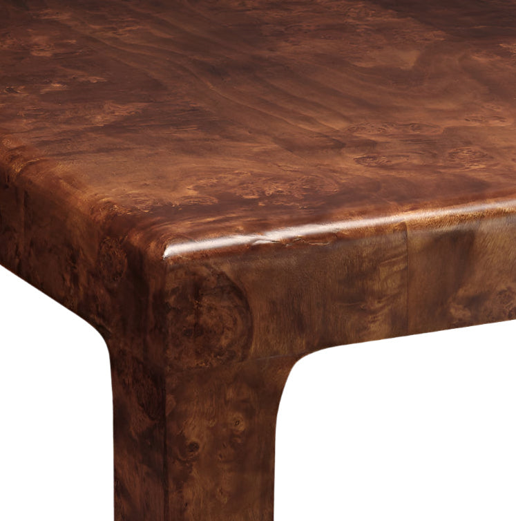 Close-up of the Made Goods Alessio Game Table's polished corner, showcasing a rich dark brown grain pattern and enhanced by sleek modern lines.