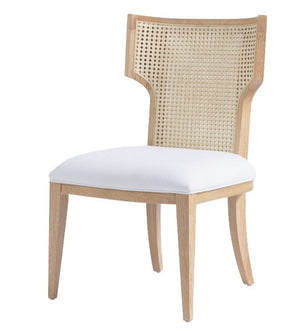 Made Goods Carleen Dining Chair with a white cushioned seat and cane backrest.