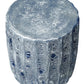 The Uriah Stool features a blue reactive ironstone finish with a cylindrical form, textured surface resembling stone, and distinctive scalloped edges.
