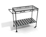 The Amalfi Bar Cart is a powder-coated steel bar cart with a glass top shelf, grid-pattern lower shelf, and four wheels, pictured against a white background.