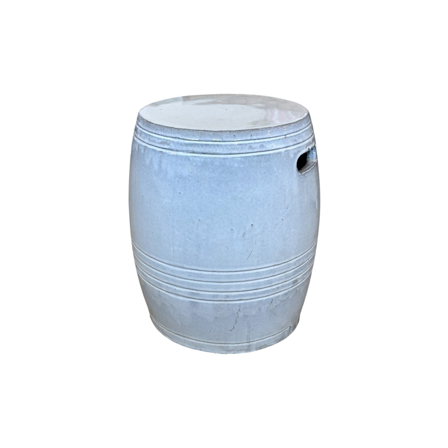 The White Barrel Stool is a fine porcelain garden stool with a barrel shape, horizontal grooves, and a handle hole on one side, shown against a white background.