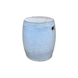 The White Barrel Stool is a fine porcelain garden stool with a barrel shape, horizontal grooves, and a handle hole on one side, shown against a white background.