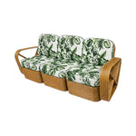 The Godfather Rattan 3 piece Sofa features curved armrests and cushions with green Calathea tropical leaf pattern upholstery on a white background.