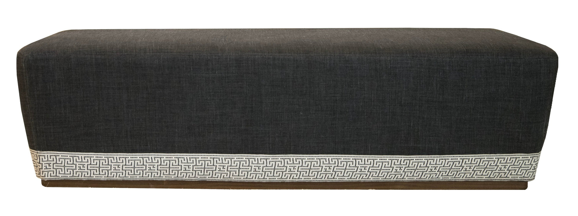 A Harlow Bench in a rectangular shape, featuring a black fabric and maze tape trim at the base.