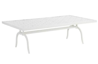 The Haret Outdoor Cocktail Table is a white rectangular cast aluminum piece featuring a fretwork-patterned seat and four elegantly curved legs.