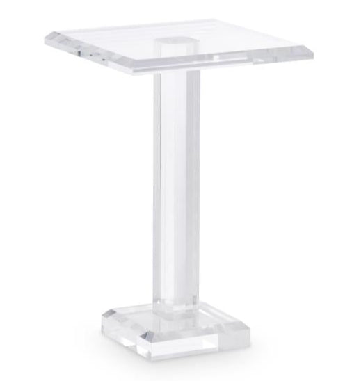 The Katie Acrylic Drink Table features a clear acrylic design with a square top, central column, and square base, adding modern sophistication to contemporary spaces. Shown here against a white background.
