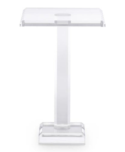 The Katie Acrylic Drink Table features a clear acrylic design with a rectangular top, central support, and square base, adding modern sophistication to any contemporary space. Photographed against a plain white background.