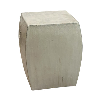 The Solid Square Stool in White is a metallic, rectangular stool with gently curved sides and a matte finish, offering an antique look inspired by handcrafted rustic designs.