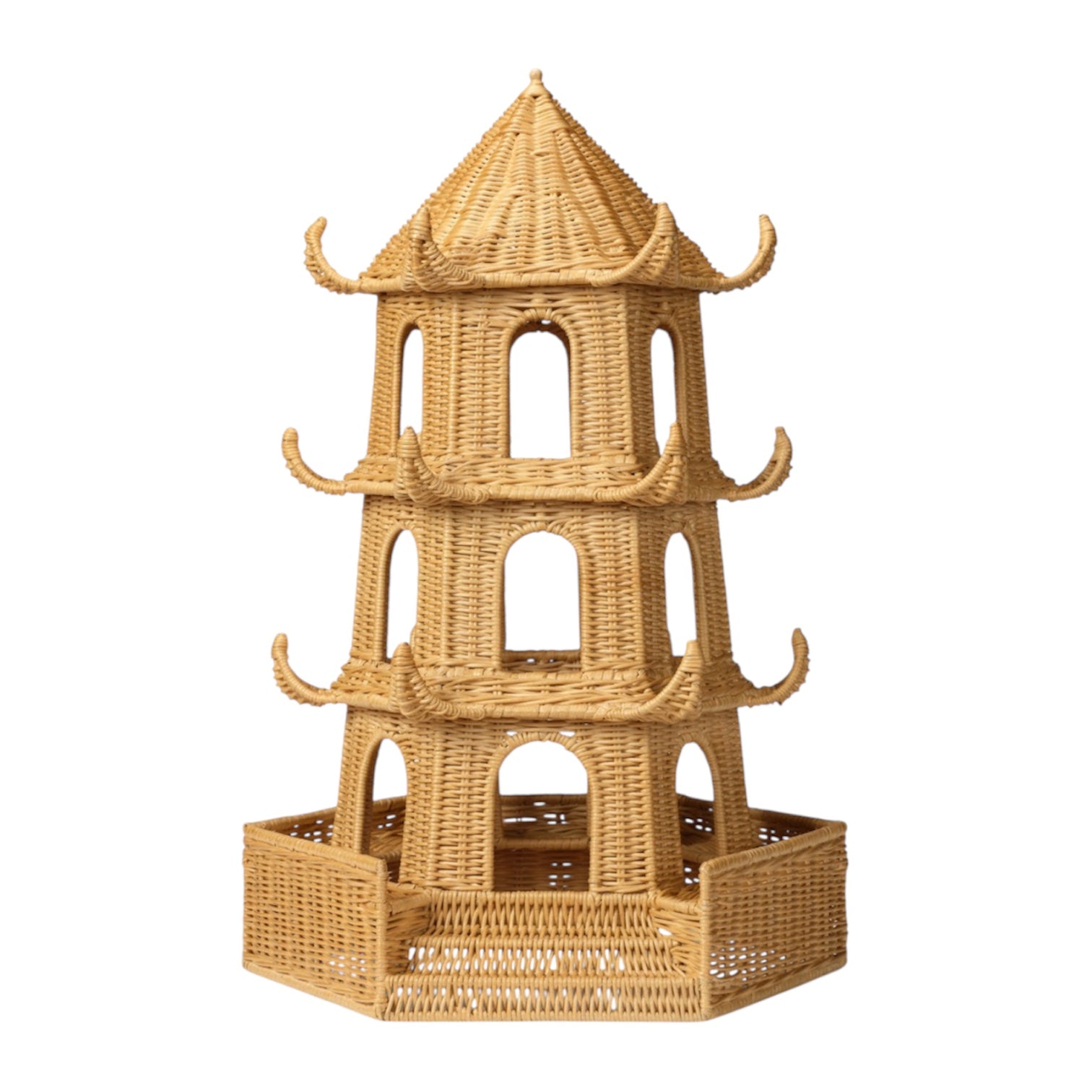 The Bardot Pagoda in Light Honey Rattan is a three-tiered, pagoda-shaped structure with arched openings, a hexagonal base, and woven rattan design inspired by Thailand’s Bardot pagodas.