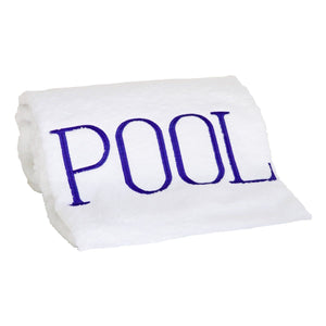 This Pool Towel, Marine Blue, features the word "POOL" embroidered in large blue letters on white cotton terry, making it the ideal poolside accessory.