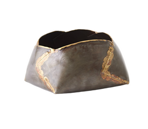 The Pleated Armor Bowl, Medium is a square ceramic bowl featuring a roughly shaped design with a gunmetal finish, accented by visible golden repair lines using the kintsugi technique.