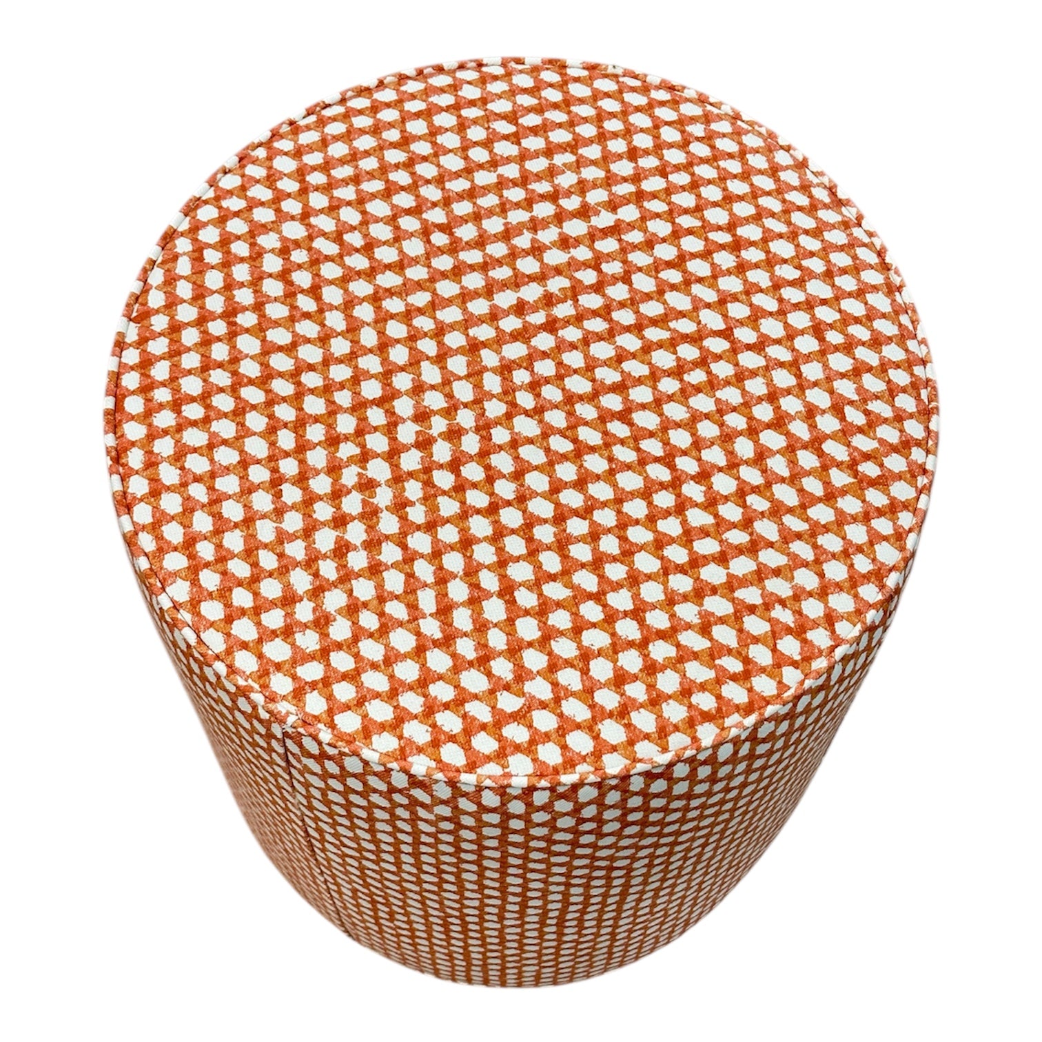 The Outdoor Drum Ottoman in Wicker Outwick Mandarin features an orange and white geometric design, making it a stylish addition to your outdoor living space.
