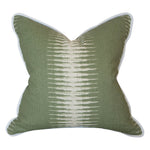 The Ikat Olive Pillow is a square green throw pillow featuring a white linear gradient center pattern and white piping, crafted from premium materials for a luxurious feel.