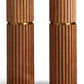 Two L'Objet Ionic Salt and Pepper Mills with a ribbed texture and brass accents, featuring a durable metal grinding mechanism, standing side by side on a white background.