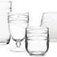 Introducing the Juliska Isabella Acrylic Collection: a set of five clear, Bohemian-style drinking glasses, each with unique sizes and shapes. These glasses feature decorative embossed lines and raised dots, making them ideal for the adventurous entertainer seeking to infuse their gatherings with artful elegance.