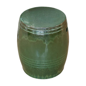 The Olive Green Cylinder Stool is crafted from quality porcelain with a glossy finish, featuring a rounded shape and subtle horizontal lines near the base, shown against a white background.