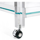 Close-up of a transparent acrylic leg with a glass shelf and black caster wheel, featured on the stylish Ava Acrylic Bar Cart.