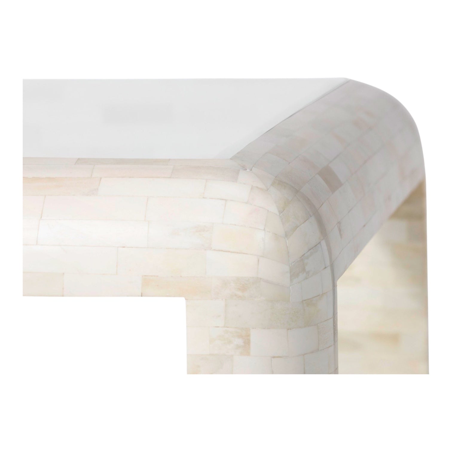 Close-up of a rounded corner on the Harley Natural Bone Coffee Table, showcasing its light-colored bone tiles and rectangular, mosaic-inspired surface.