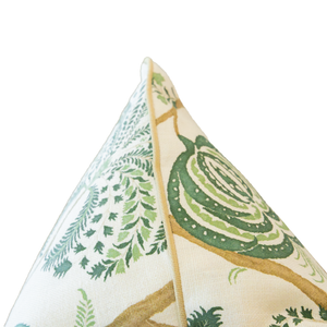 Close-up of the corner of the Turquerie Green Pillow, showcasing its green and brown nature-inspired pattern on a white background and featuring a hidden zipper closure for a seamless look.