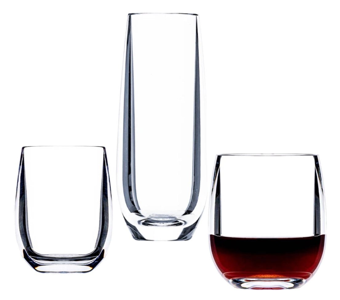 Three tumblers from the Bold Oasis Acrylic Collection on display: a tall and slender acrylic glass in the center, a shorter one on the left, and a modern curve Italian-inspired stemless wine tumbler filled with a dark liquid on the right.