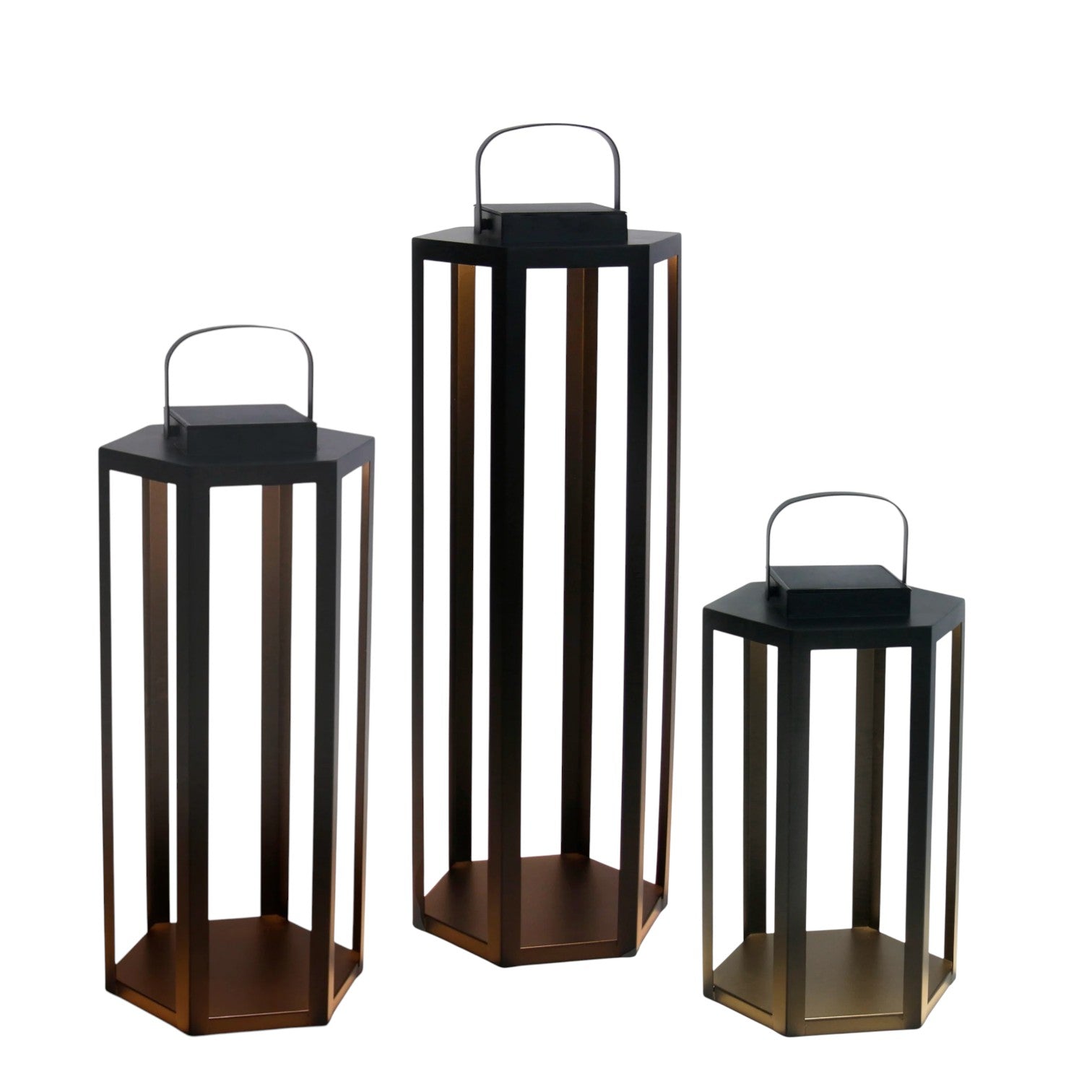 The Joyce Solar Lantern Collection features three hexagonal contemporary lanterns of varying heights with handles, open frames, and flat bases—ideal for stylish outdoor lighting—displayed on a white background.