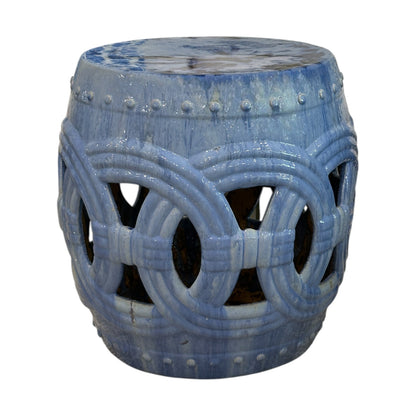 The Large Circle Garden Stool in Blue features a glazed ceramic finish with interlocking circle cutouts, giving it an antique look inspired by traditional dragon kiln craftsmanship.