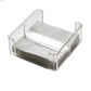A stack of white napkins is elegantly displayed in a holder from the Mario Luca Giusti Caspar Acrylic Napkin Holder Collection, embodying a modern aesthetic.