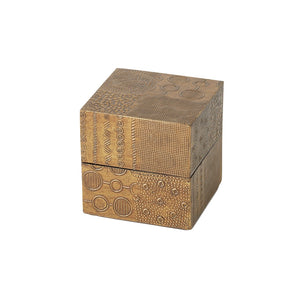 The Navigator Square Box in Antique Brass, Small, features geometric patterns and textures on bronze-toned brass sheeting with a lid—an elegant decorative addition to any collection.