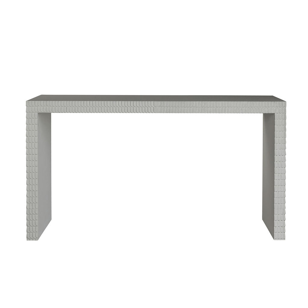 The Lance Console Table is a rectangular, modern piece with a minimalist design and textured geometric edges, finished in sleek white gesso and displayed against a white background.