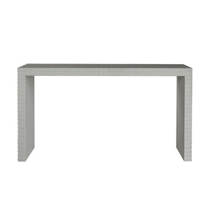 The Lance Console Table is a rectangular, modern piece with a minimalist design and textured geometric edges, finished in sleek white gesso and displayed against a white background.